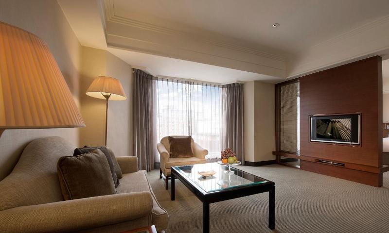 Regent Taipei Hotel Exterior photo A living room in a suite at the hotel